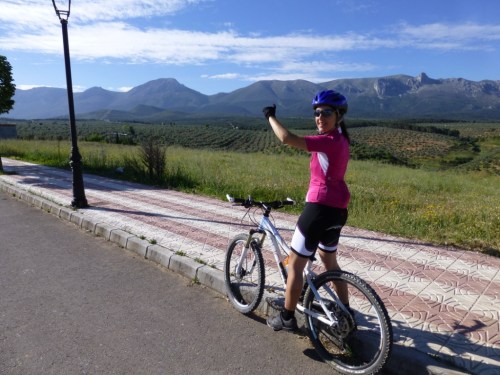 Her finger points to the notch in the mountain where we are going...