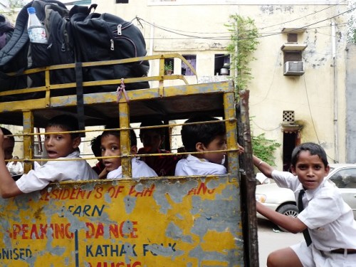 Some kids going home from school outside our hotel in Delhi. They love cameras here. 